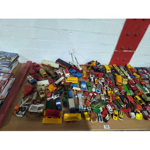 704 - A collection of playworn diecast model cars to include Corgi, Matchbox, Tonka, etc