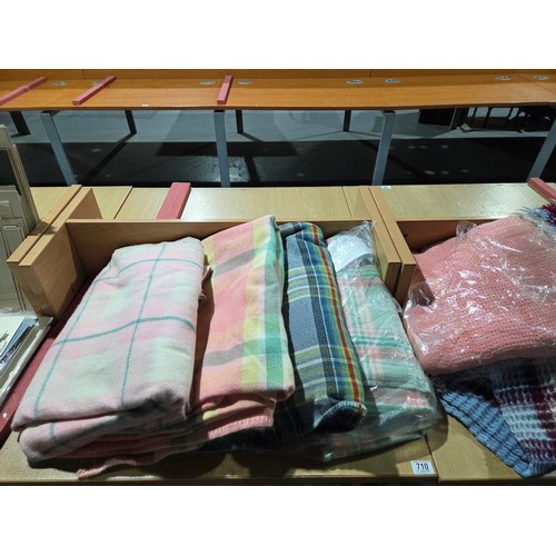 710 - Seven woollen and waffle blankets