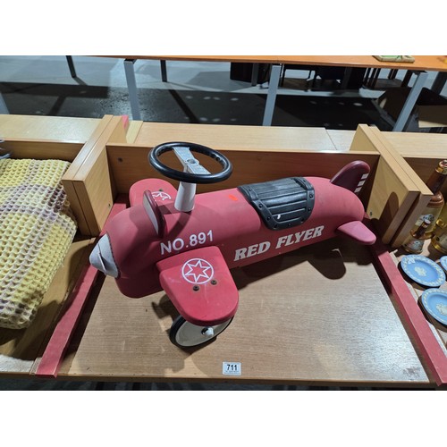 711 - A child's push along aeroplane