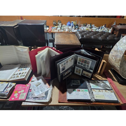 520 - A collection of World stamps (mostly mint), coins and First Day covers