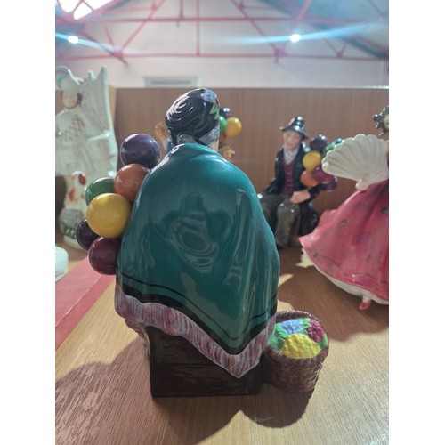 517 - Eight large Royal Doulton figurines - The Old Balloon Seller, The Balloon Seller, Biddy Pennyfarthin... 