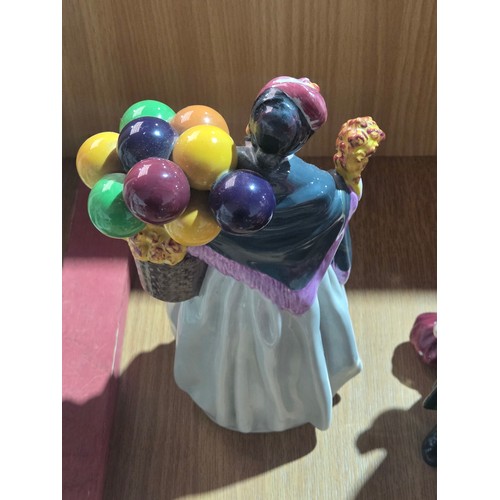 517 - Eight large Royal Doulton figurines - The Old Balloon Seller, The Balloon Seller, Biddy Pennyfarthin... 