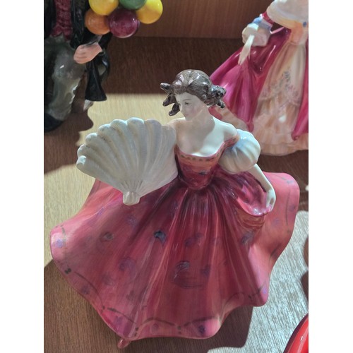 517 - Eight large Royal Doulton figurines - The Old Balloon Seller, The Balloon Seller, Biddy Pennyfarthin... 