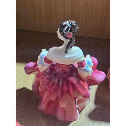 517 - Eight large Royal Doulton figurines - The Old Balloon Seller, The Balloon Seller, Biddy Pennyfarthin... 