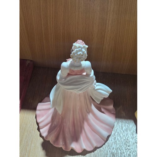 519 - A collection of Royal Doulton, Royal Worcester and Coalport figurines of varying sizes