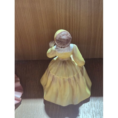 519 - A collection of Royal Doulton, Royal Worcester and Coalport figurines of varying sizes