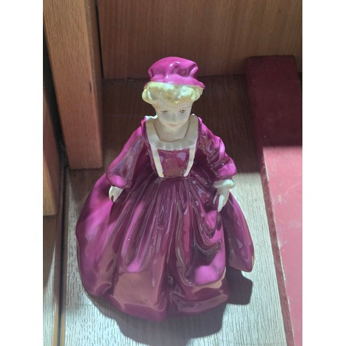 519 - A collection of Royal Doulton, Royal Worcester and Coalport figurines of varying sizes