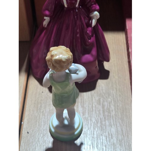 519 - A collection of Royal Doulton, Royal Worcester and Coalport figurines of varying sizes