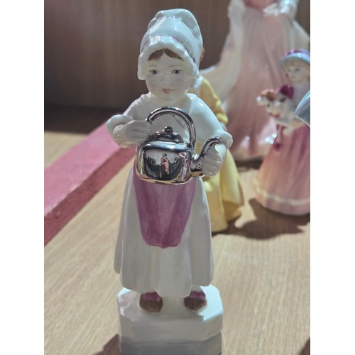 519 - A collection of Royal Doulton, Royal Worcester and Coalport figurines of varying sizes