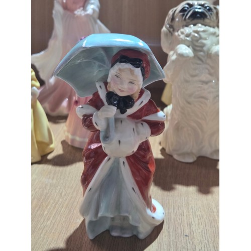 519 - A collection of Royal Doulton, Royal Worcester and Coalport figurines of varying sizes
