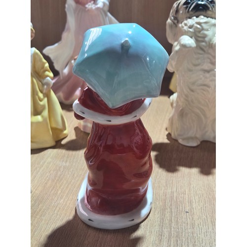 519 - A collection of Royal Doulton, Royal Worcester and Coalport figurines of varying sizes
