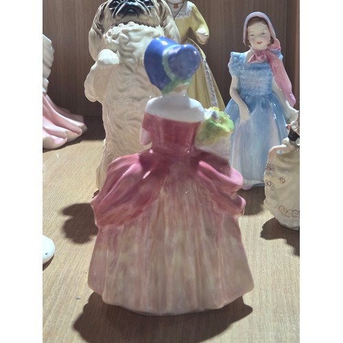 519 - A collection of Royal Doulton, Royal Worcester and Coalport figurines of varying sizes