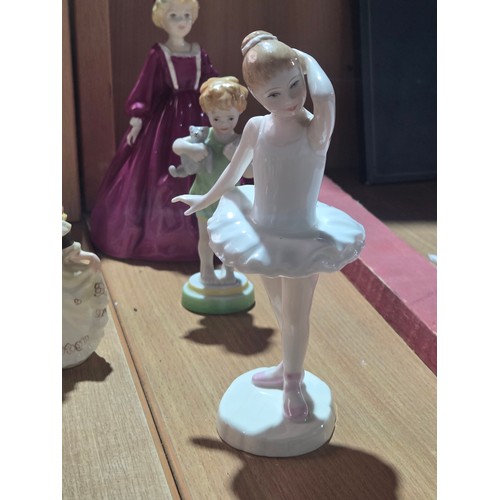 519 - A collection of Royal Doulton, Royal Worcester and Coalport figurines of varying sizes