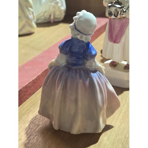 519 - A collection of Royal Doulton, Royal Worcester and Coalport figurines of varying sizes