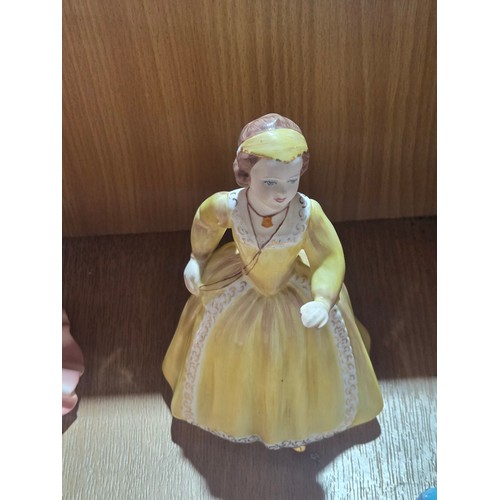 519 - A collection of Royal Doulton, Royal Worcester and Coalport figurines of varying sizes