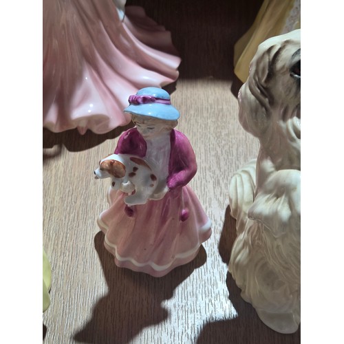 519 - A collection of Royal Doulton, Royal Worcester and Coalport figurines of varying sizes