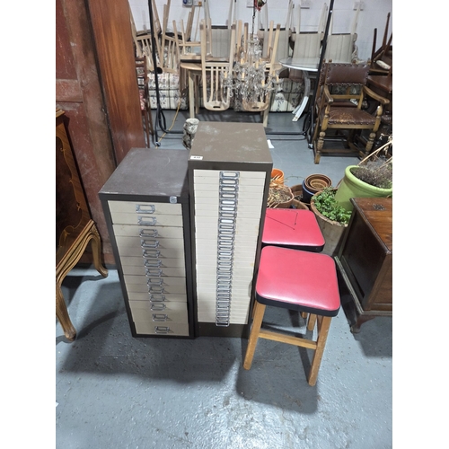 430 - A thirty drawer metal filing cabinet with a thirteen drawer metal filing cabinet and two stools
