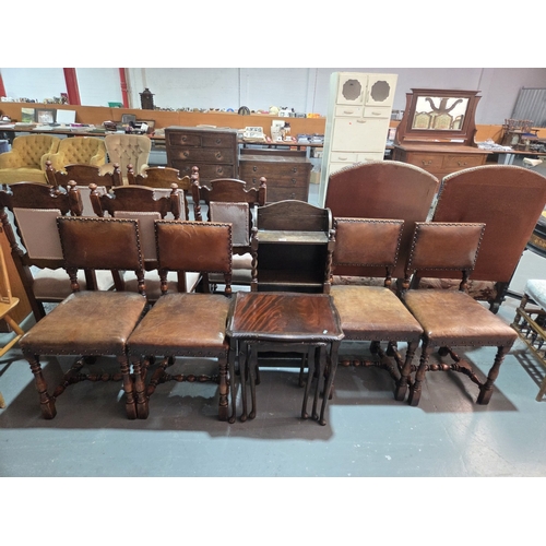 444 - Four leatherette upholstered dining chairs, nest of tables and an oak bookcase
