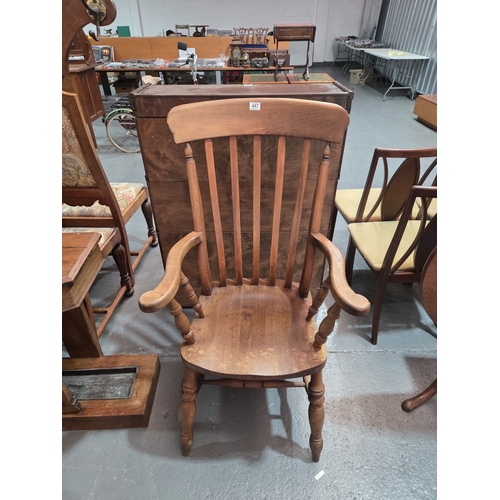 447 - An oak lath back Windsor style armchair