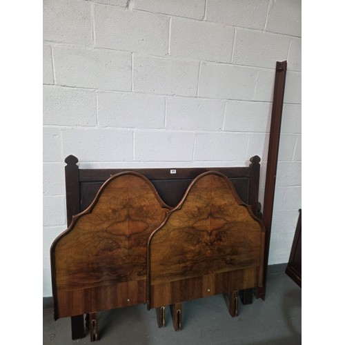 455 - An oak double bed frame with two walnut headboards