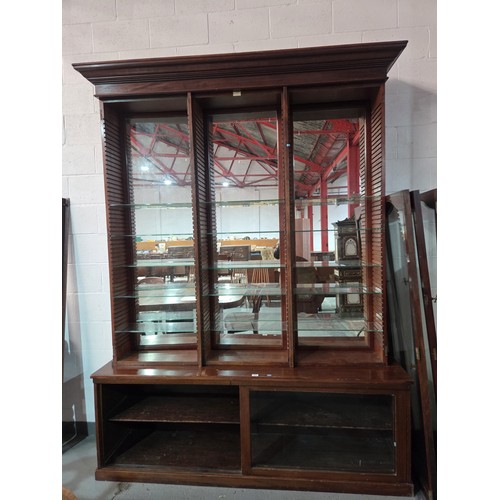 456 - A large mahogany chemist display cabinet with mirrored back, adjustable shelves, top with glass fron... 