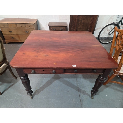 459 - A mahogany dining table with drawers either side