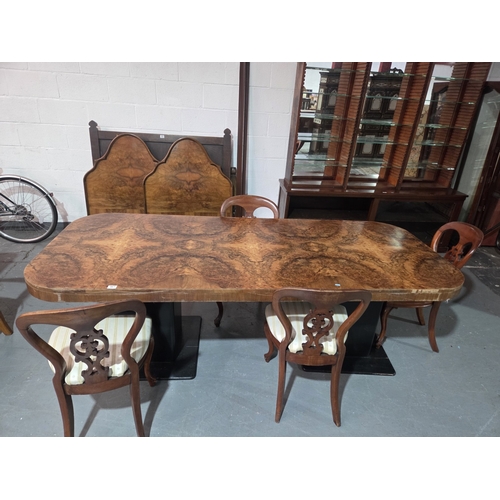 461 - A walnut boardroom table on ebonised base with four chairs