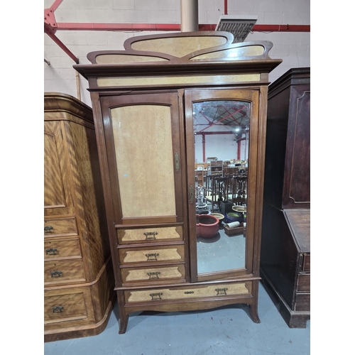 466 - A hardwood double wardrobe with mirrored door measurements: Height 240cm, width 130cm, depth 52cm
