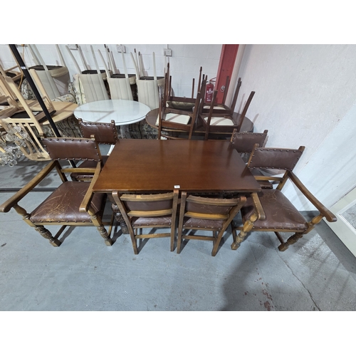 470 - An oak draw leaf dining table and six chairs