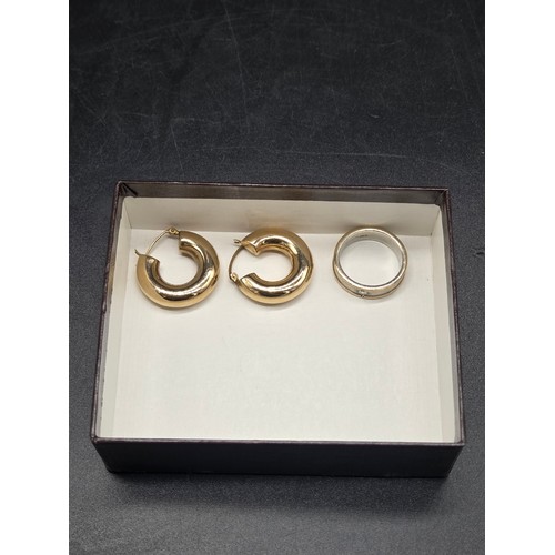505 - A pair of 9k gold earrings and a 9k gold (white and yellow) ring - combined weight including tiny di... 