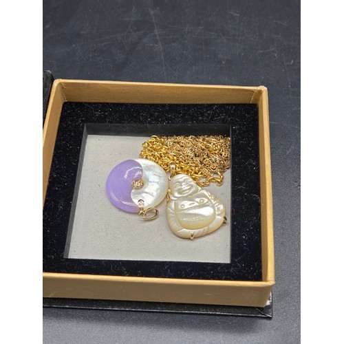 511 - Two 9k gold chains (weight 3.1 grams) together with two pendants with gold mounts
