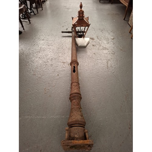 476 - A 19th Century cast iron street lamp with reproduction copper lantern, the post has typical floral d... 