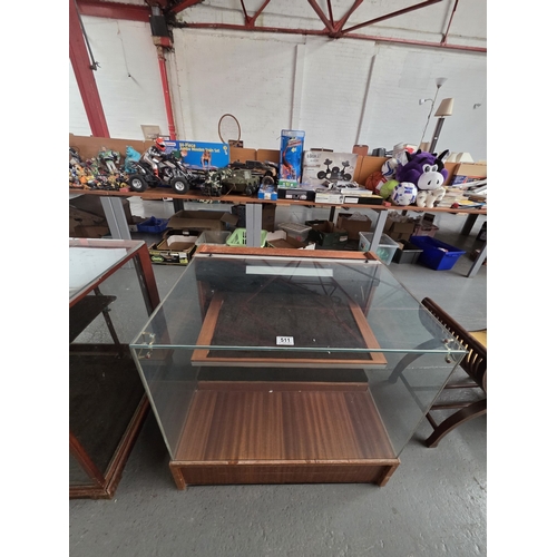 511 - A small glazed shop display counter

Height 73cm, width 76cm, depth 60cm