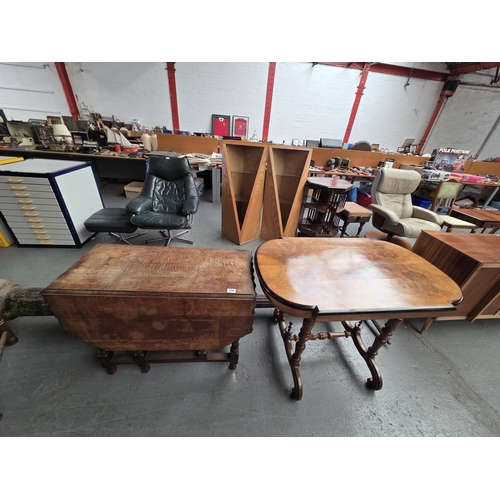 530 - A walnut tea table with an oak drop leaf dining table on barley twist supports