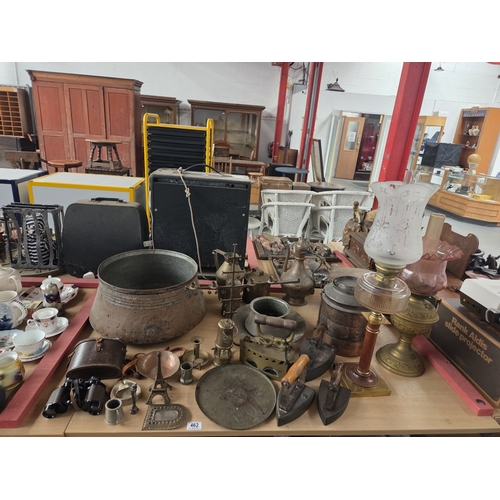 462 - Oil lamps, early copper pots and pans, antique irons and other interesting metalware