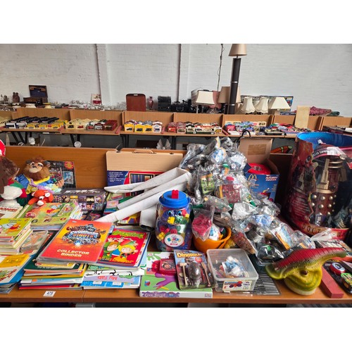 475 - A large quantity of toys, games and books to include bagged McDonald's toys