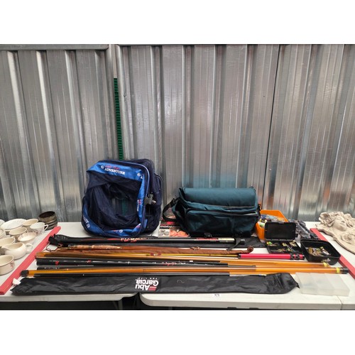 479 - A quantity of fishing items - rods, lures, net bag etc; and a vintage split cane rod