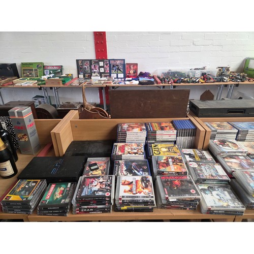 719 - A Playstation 2 and Playstation 3 console (no controllers or leads) with an assortment of Playstatio... 