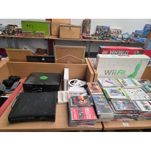 721 - An XBox and XBox 360 console, Nintendo Wii console with accessories and an assortment of Wii, XBox a... 