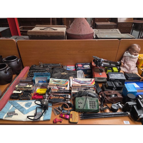 727 - A Remington typewriter, Kodak, Vivitar and other cameras and lenses, Tonka trucks, and other vintage... 