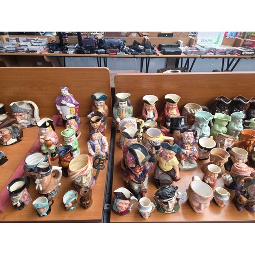 741 - A large variety of Toby jugs to include Lancaster, Staffordshire, Ridgeway etc.