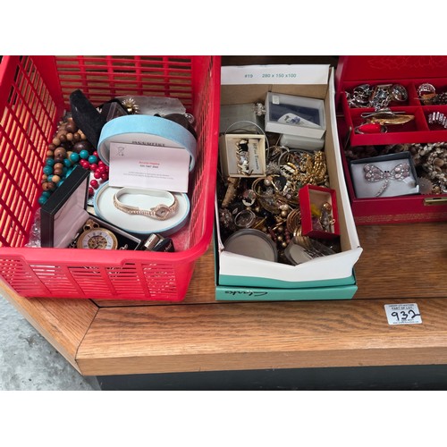 932 - A quantity of costume jewellery displayed over three shelves