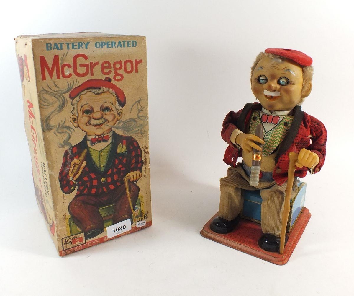 A Rosco battery operated McGregor smoking man toy boxed