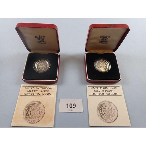 109 - A Royal mint issue: (2) silver proof one pound coins 1983 in cases with certificates. Condition: UNC