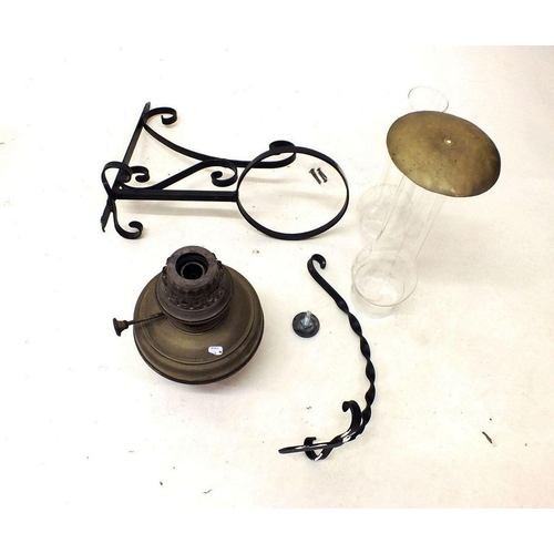 1094 - A 19th century brass oil lamp with cast iron bracket and upper covering bracket