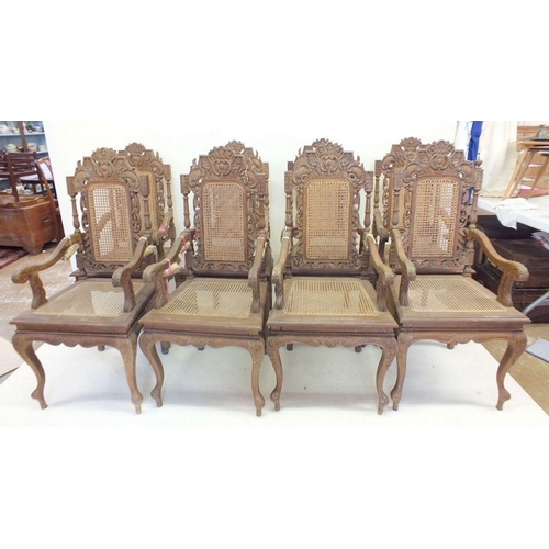 1150 - A set of eight Malaysian Colonial (Malaccan) carved hardwood dining chairs in mock Jacobean style wi... 