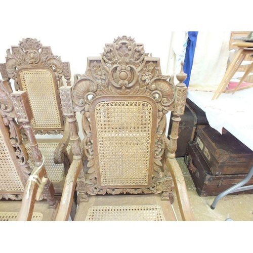 1150 - A set of eight Malaysian Colonial (Malaccan) carved hardwood dining chairs in mock Jacobean style wi... 