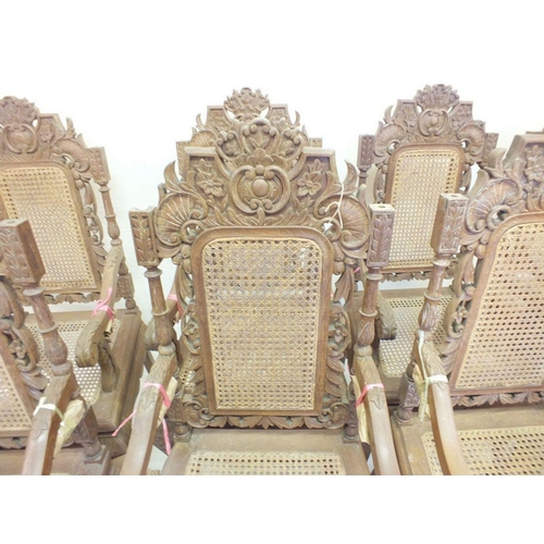 1150 - A set of eight Malaysian Colonial (Malaccan) carved hardwood dining chairs in mock Jacobean style wi... 