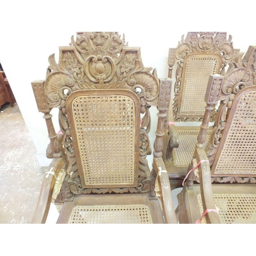 1150 - A set of eight Malaysian Colonial (Malaccan) carved hardwood dining chairs in mock Jacobean style wi... 