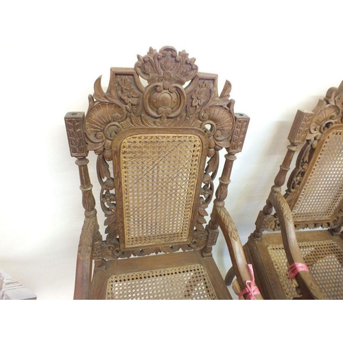 1150 - A set of eight Malaysian Colonial (Malaccan) carved hardwood dining chairs in mock Jacobean style wi... 